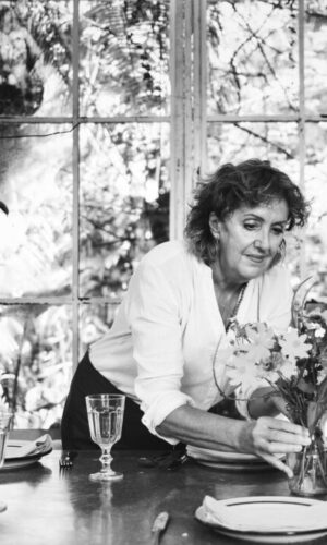 Woman arranging a table in a cafe Woman arranging a table in a cafe