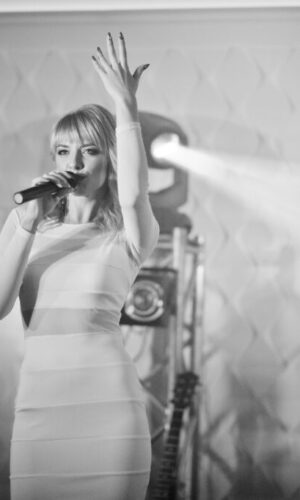 Musicial music live band performing on a stage with different li Musicial music live band performing on a stage with different li